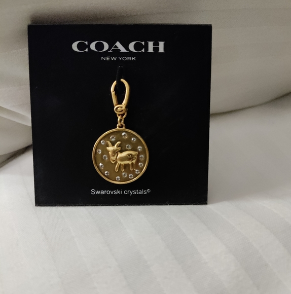 Coach gold tone Capricorn charm Swarovski Crystals